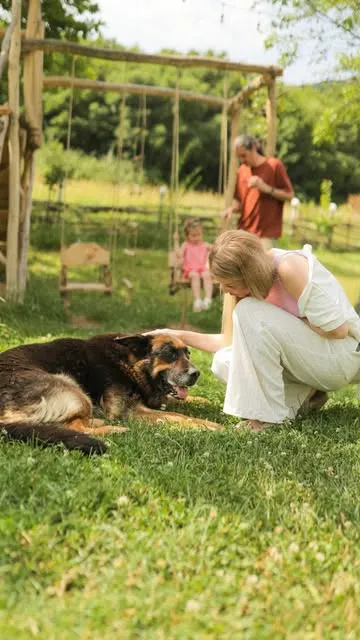 Family and dog outdoors at Vardeni